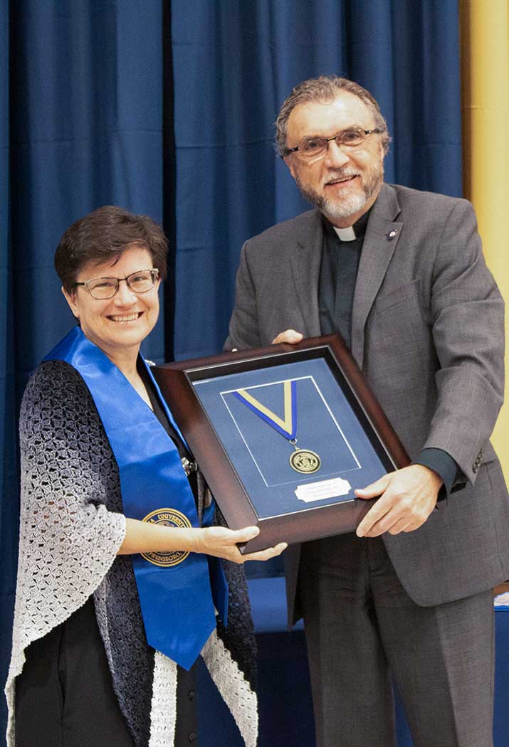 Sister Anita Louise receives the Distinguished Alumni Award from Brescia University.