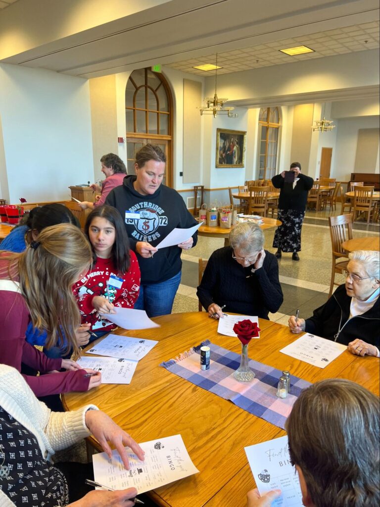 Middle school girls visit with the Sisters of St. Benedict